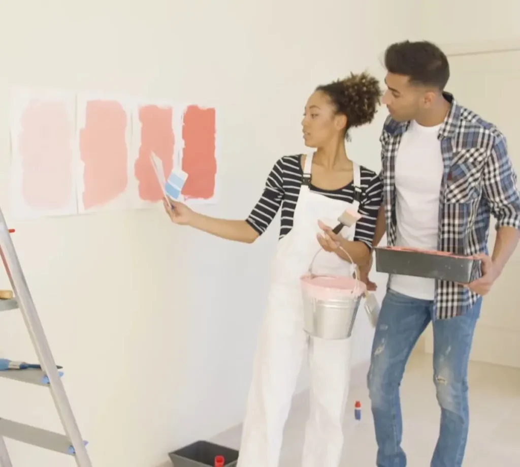 couple painting the wall