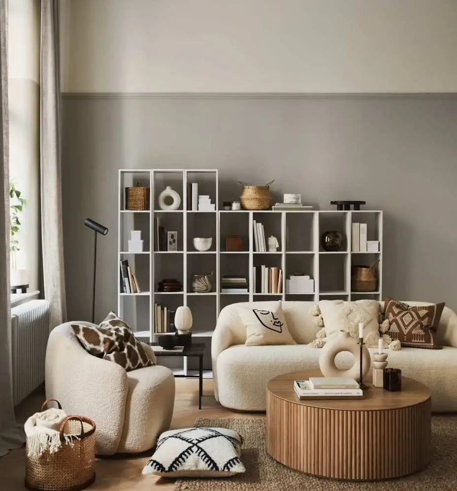 neutral color living room with curved sofa