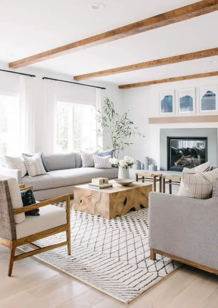 white living room with wooden beam