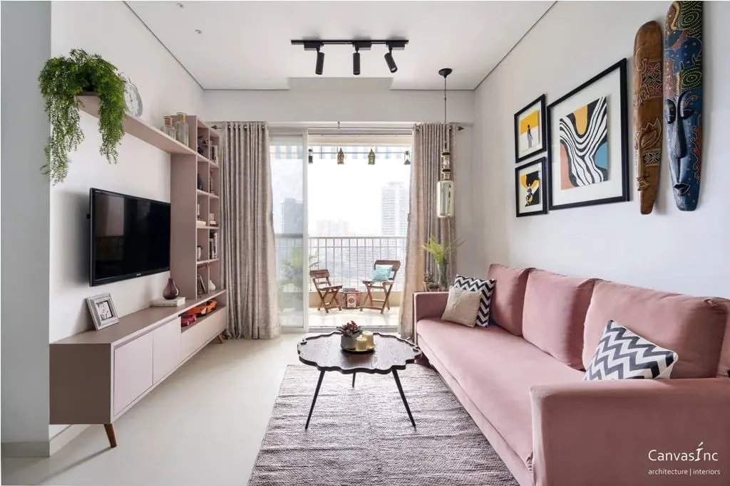 pink sofa and TV unit in living room