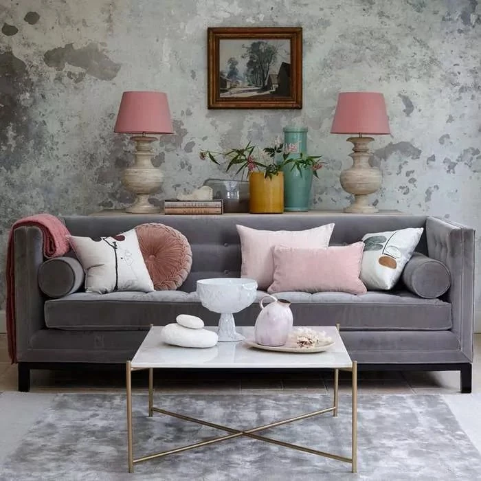 grey wallpaper with sage sofa in living room