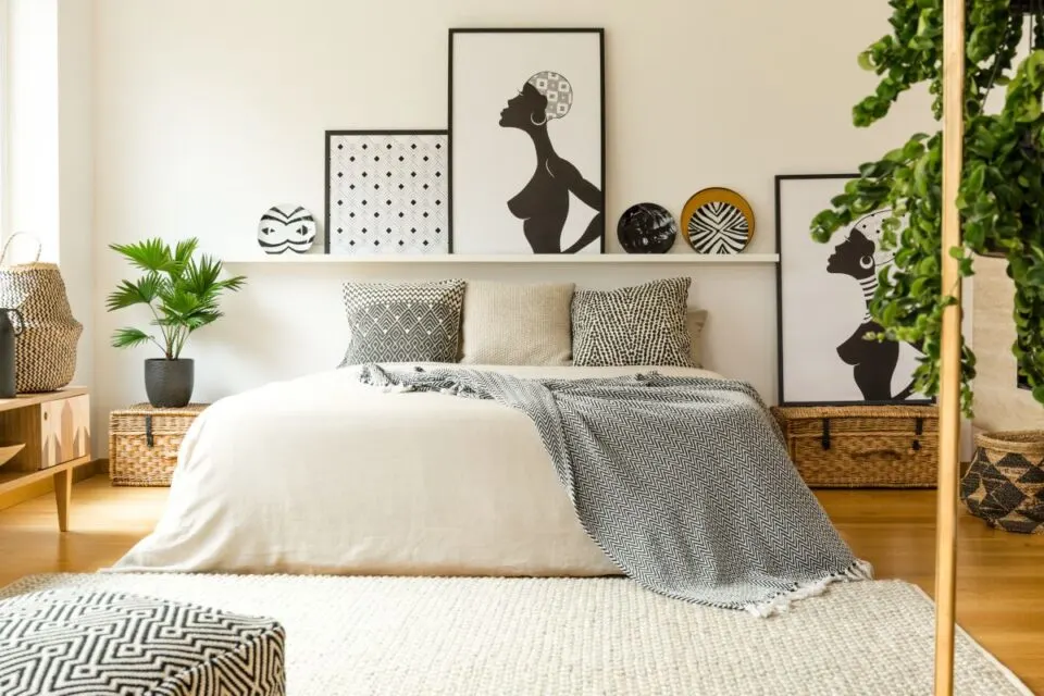 Posters and Patterned Plates in boho bedroom