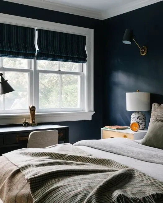 teen boy bedroom with navy blue walls