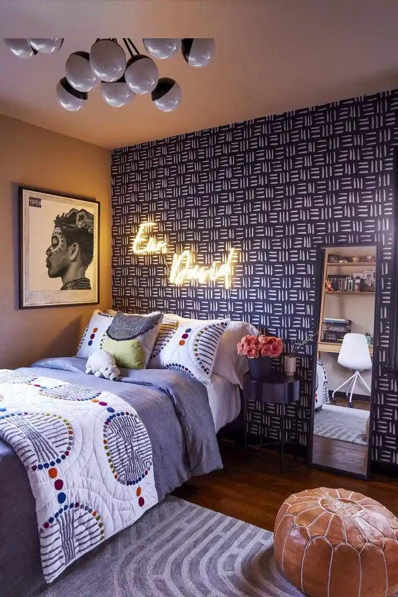 teen boy bedroom with wallpaper and a large bedroom mirror
