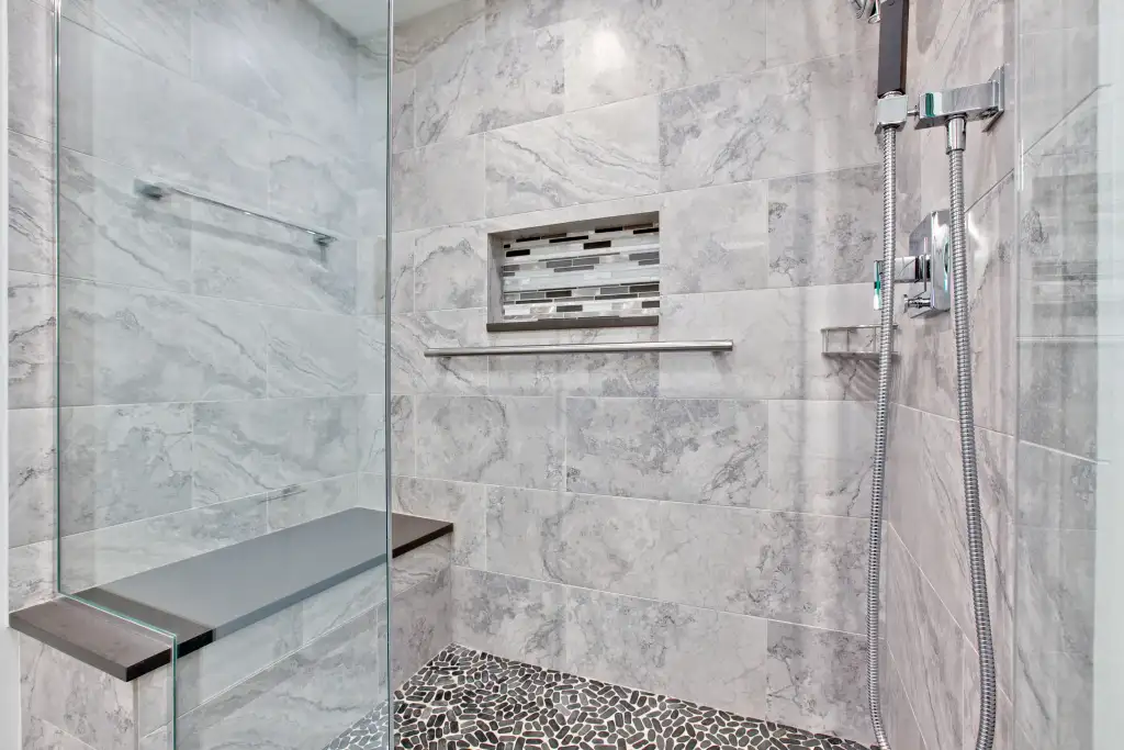 grab bar and shower seat in the bathroom