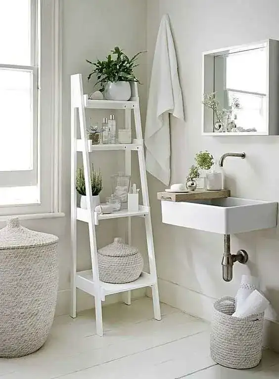 white vintage ladder shelves in small bathroom to increase counter space