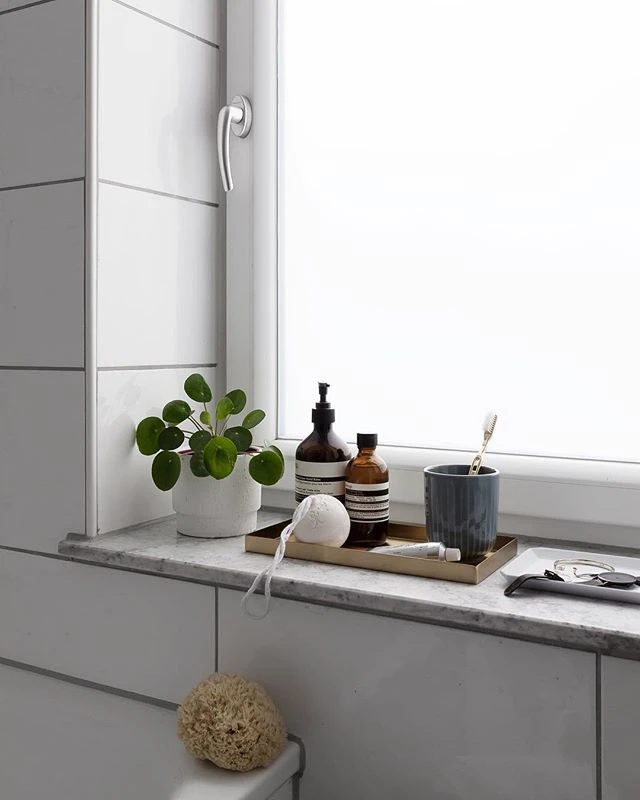 windowsill tray in small bathroom
