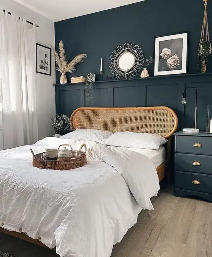 bedroom with floating shelve on the headboard wall