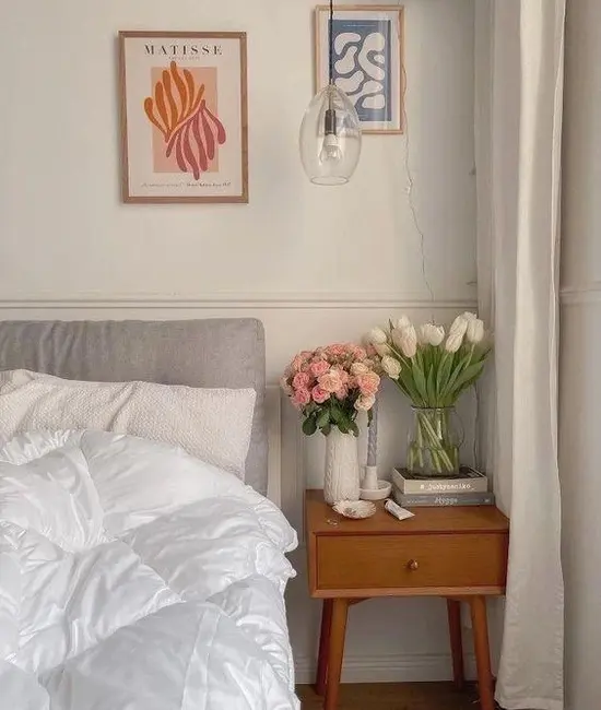 bedroom with fresh flower on the bedside table