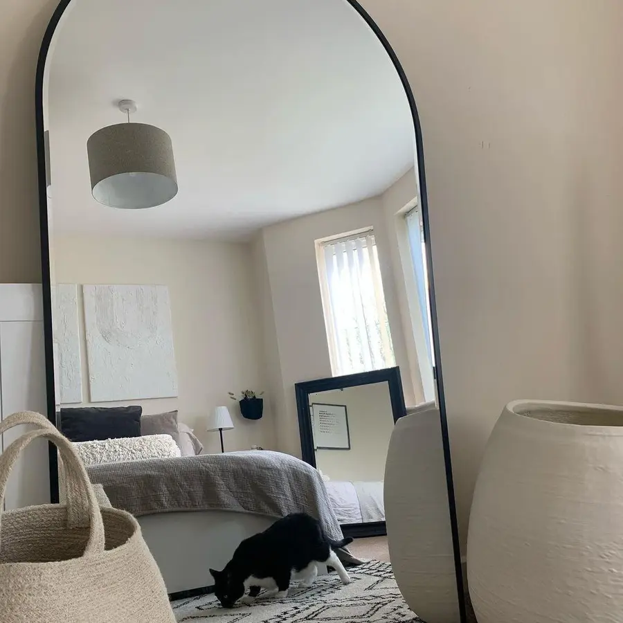 bedroom with large mirror
