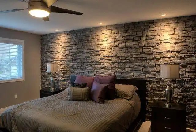 bedroom with stone headboard wall