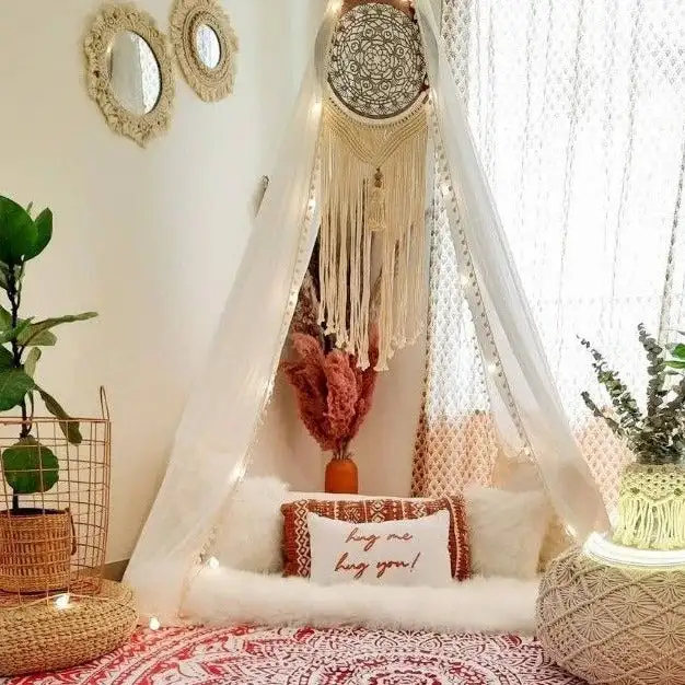 white sheer curtain canopy in bohemian bedroom
