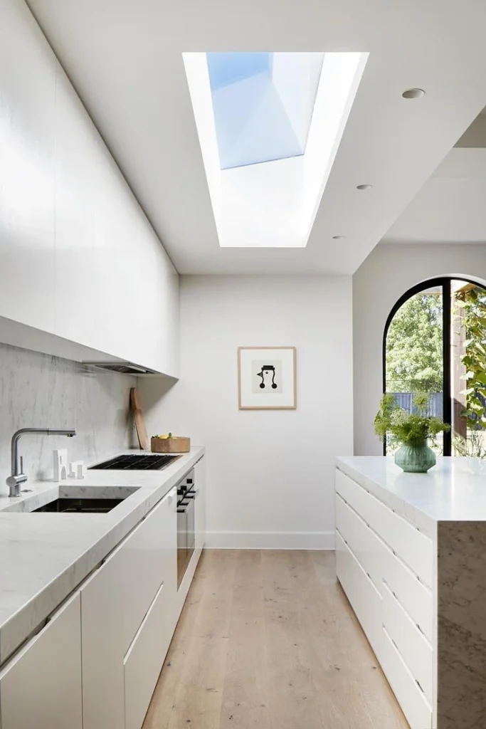 white kitchen with ceiling window