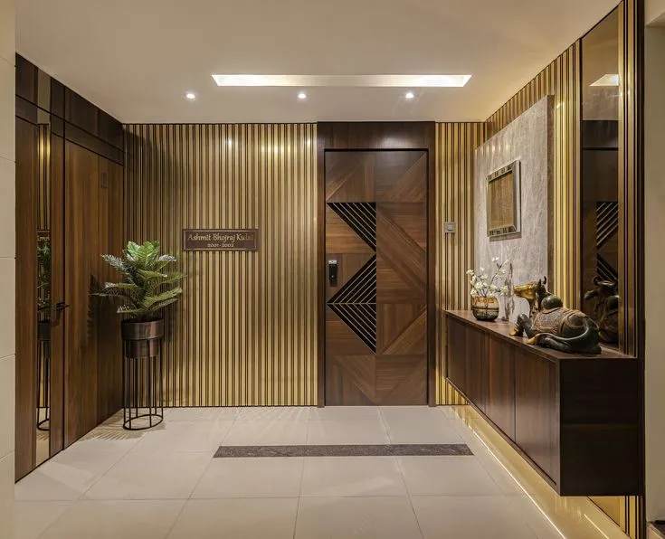 golden accent with warn lighting flat entrance lobby design