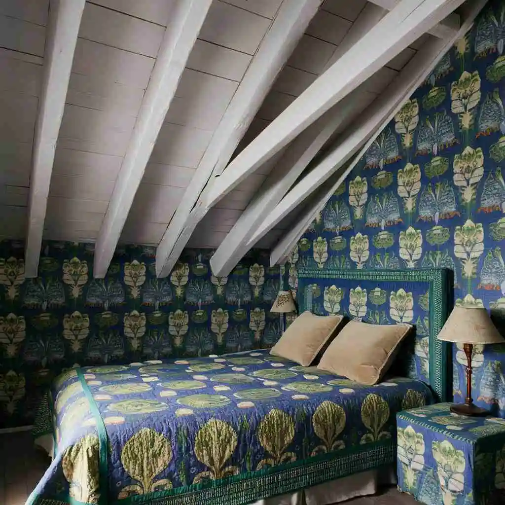 small bedroom blue floral wallpaper and wooden ceiling