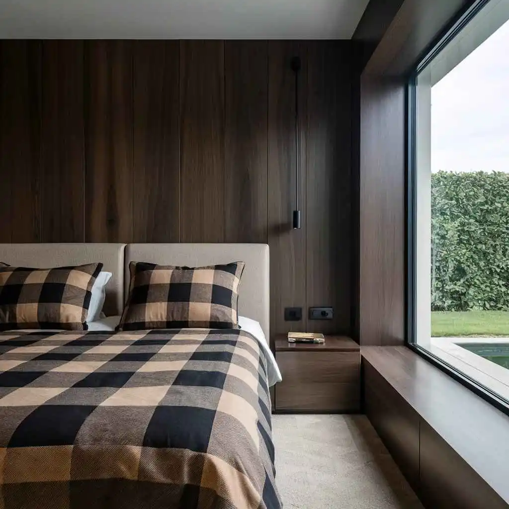 wooden wall with large window in small bedroom